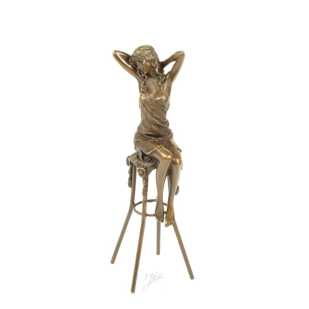 A BRONZE SCULPTURE OF A LADY ON BARCHAIR