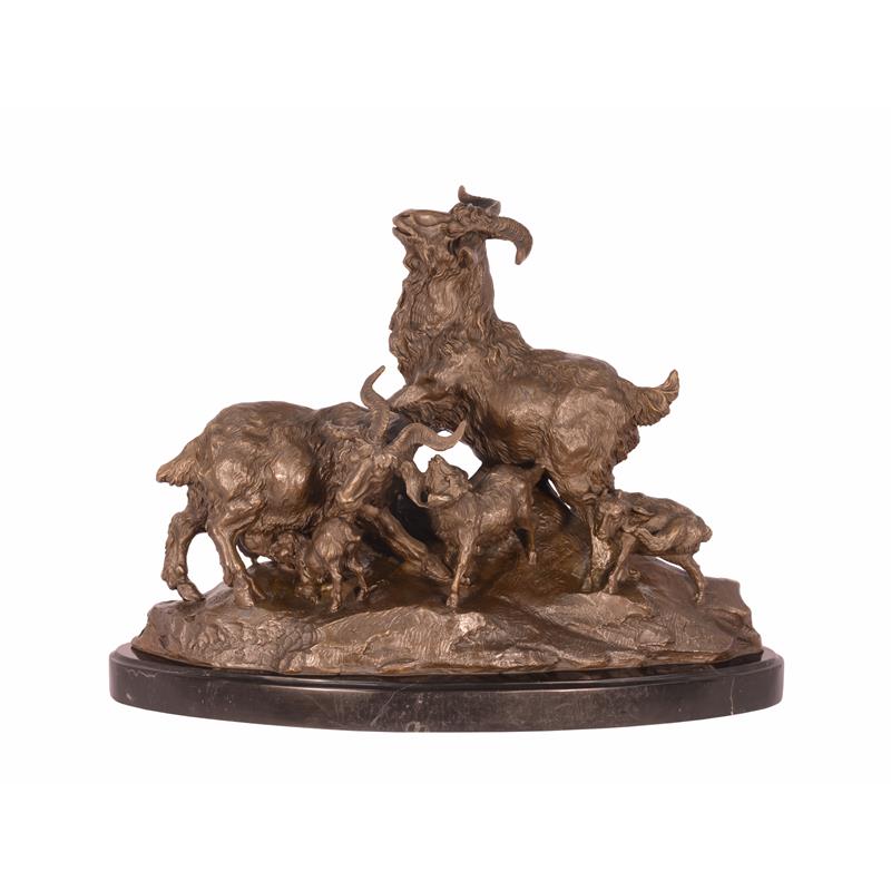 A BRONZE GROUP OF A FAMILY OF GOATS