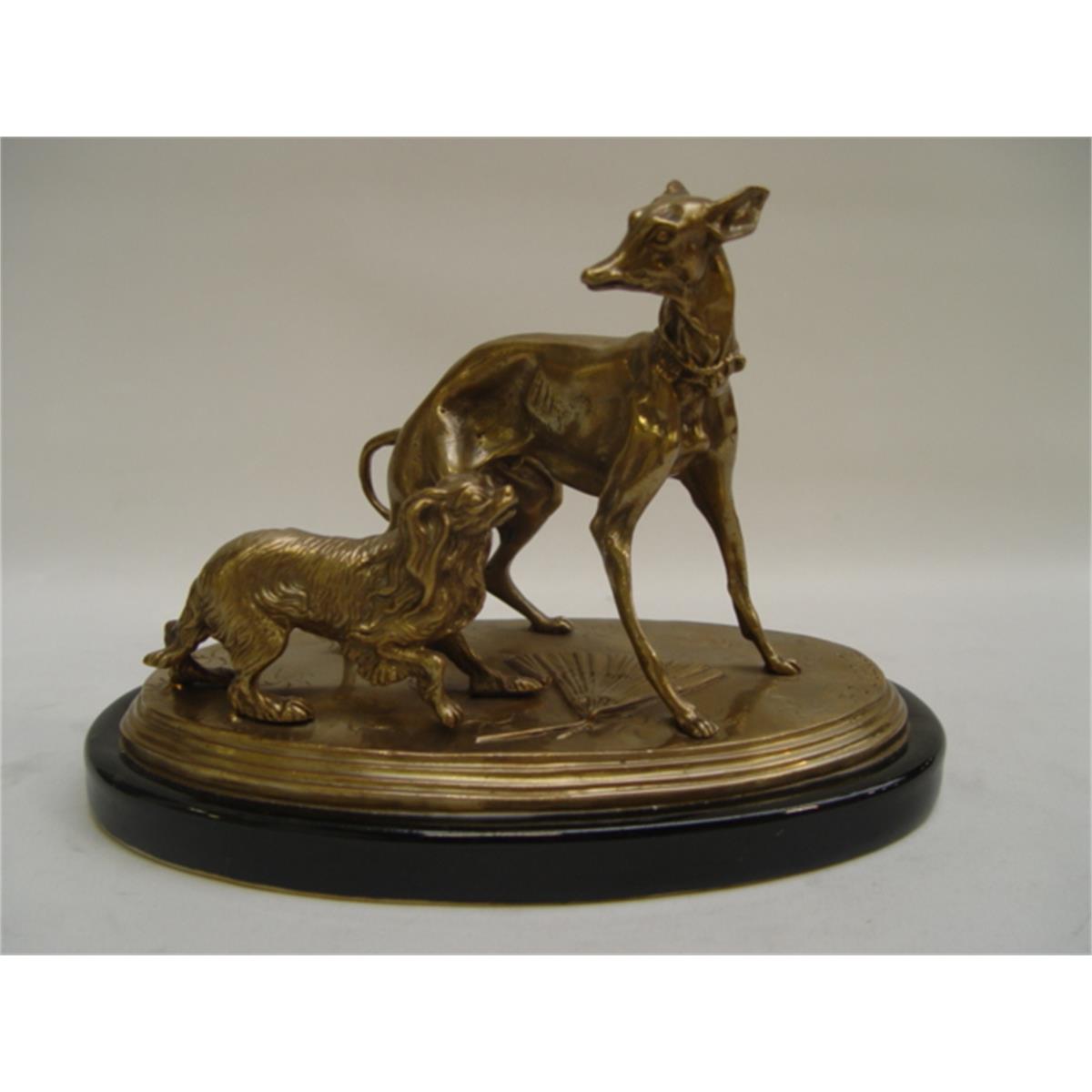 A GROUP OF BRASS DOGS ON PORCELAIN BASE