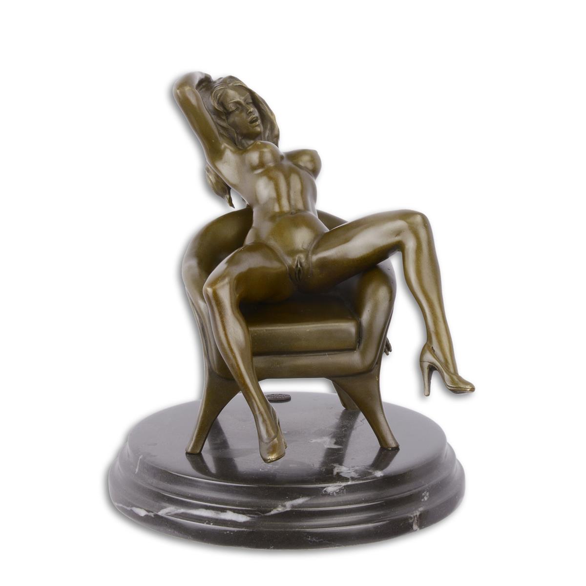 AN EROTIC BRONZE SCULPTURE OF A SEATED FEMALE NUDE